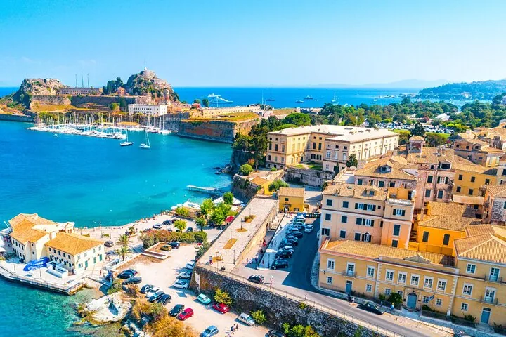 Aerial view of a beautiful coastal town with historic buildings and a marina
